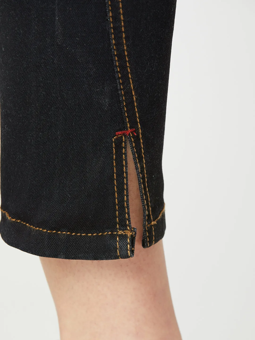 Women's Black Skinny High Rise Side Slit Solid Eyelet Embellished Cropped Length Stretchable Denim Jeans